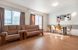 One-Bedroom Unit - dining table and sofas