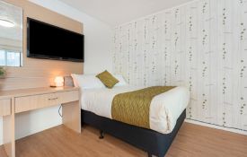 One-Bedroom Unit - bed and TV