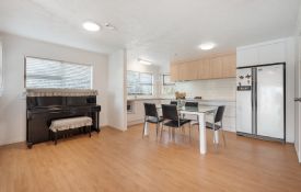 Three-Bedroom Unit - piano and dining table
