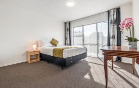 Three-Bedroom Unit - queen-size bed